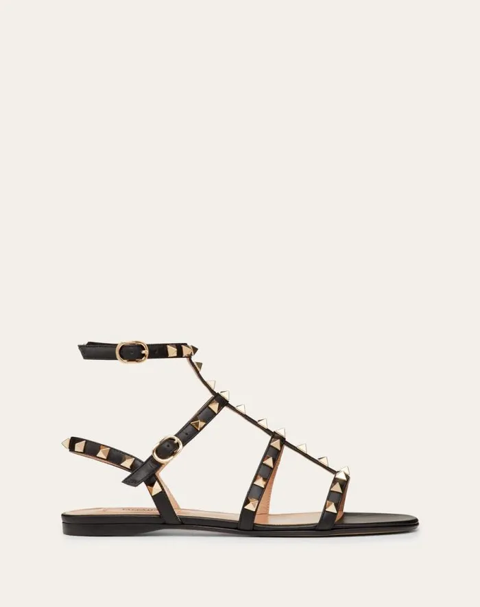 Valentino Sandals Woman Rockstud Flat Calfskin Sandal With Straps For Woman In Poudre Poudre