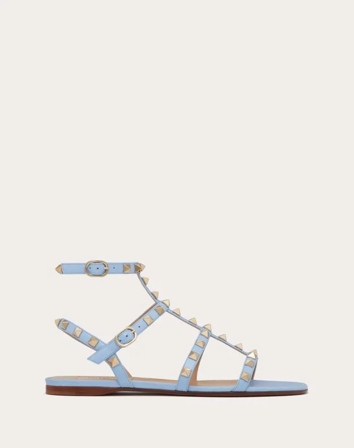Valentino Sandals Woman Rockstud Flat Calfskin Sandal With Straps For Woman In Poudre Poudre
