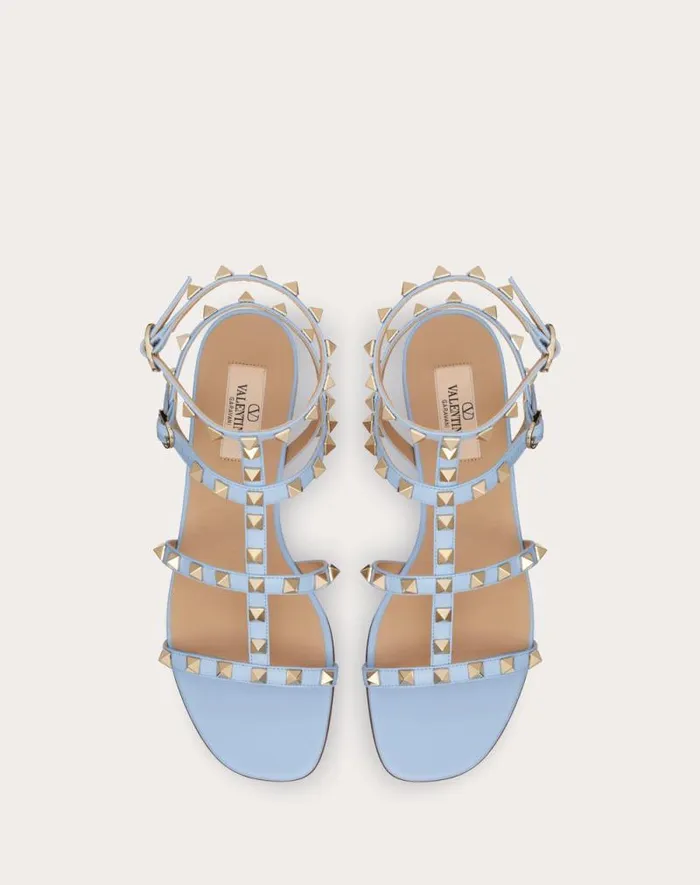 Valentino Sandals Woman Rockstud Flat Calfskin Sandal With Straps For Woman In Poudre Poudre