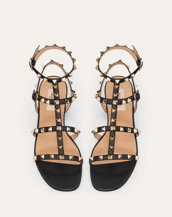 Valentino Sandals Woman Rockstud Flat Calfskin Sandal With Straps For Woman In Poudre Poudre