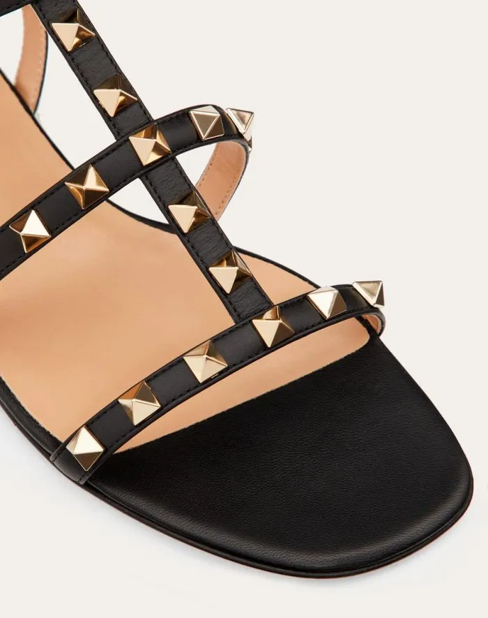 Valentino Sandals Woman Rockstud Flat Calfskin Sandal With Straps For Woman In Poudre Poudre