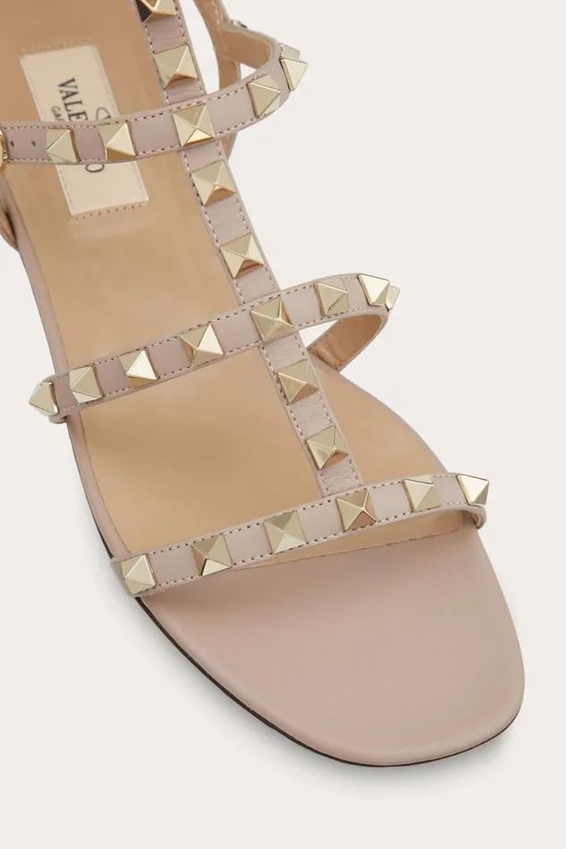 Valentino Sandals Woman Rockstud Flat Calfskin Sandal With Straps For Woman In Poudre Poudre